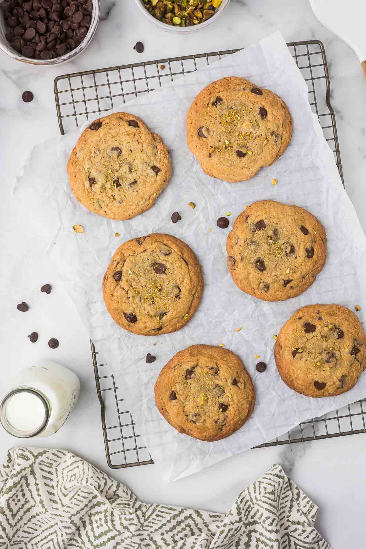 Pistachio cookies on a cooling rack.