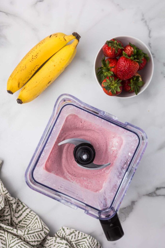 Strawberry milkshake after blending in a blender.