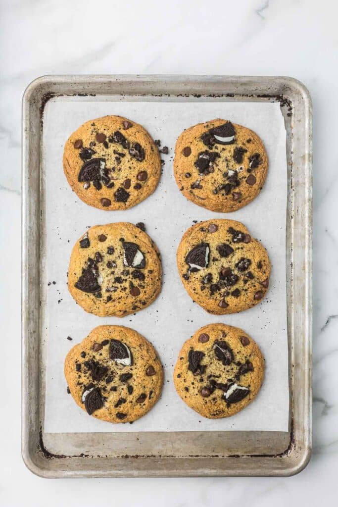 Chocolate oreo cookies that have been baked on a cookie sheet.