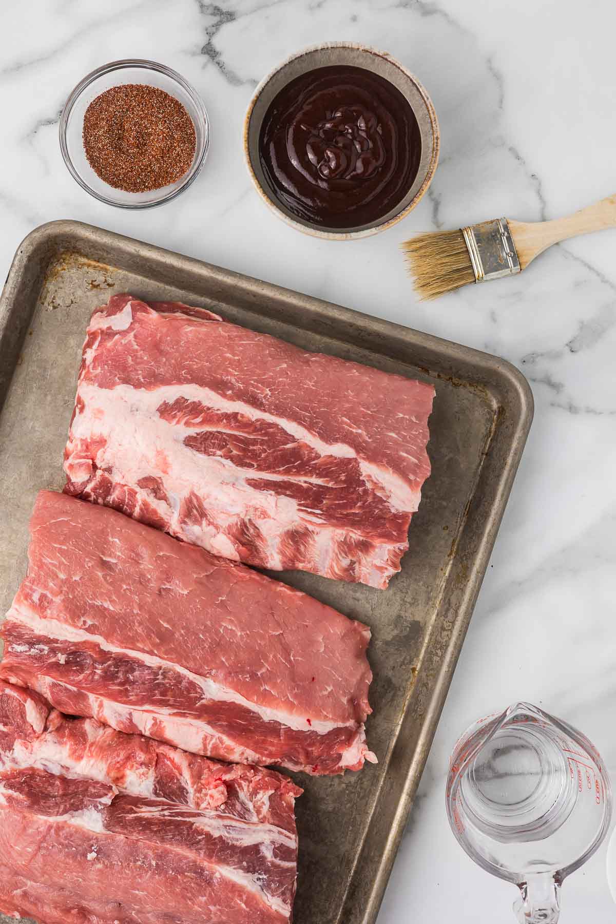 Ingredients to make a slow cooker babyback ribs recipe.