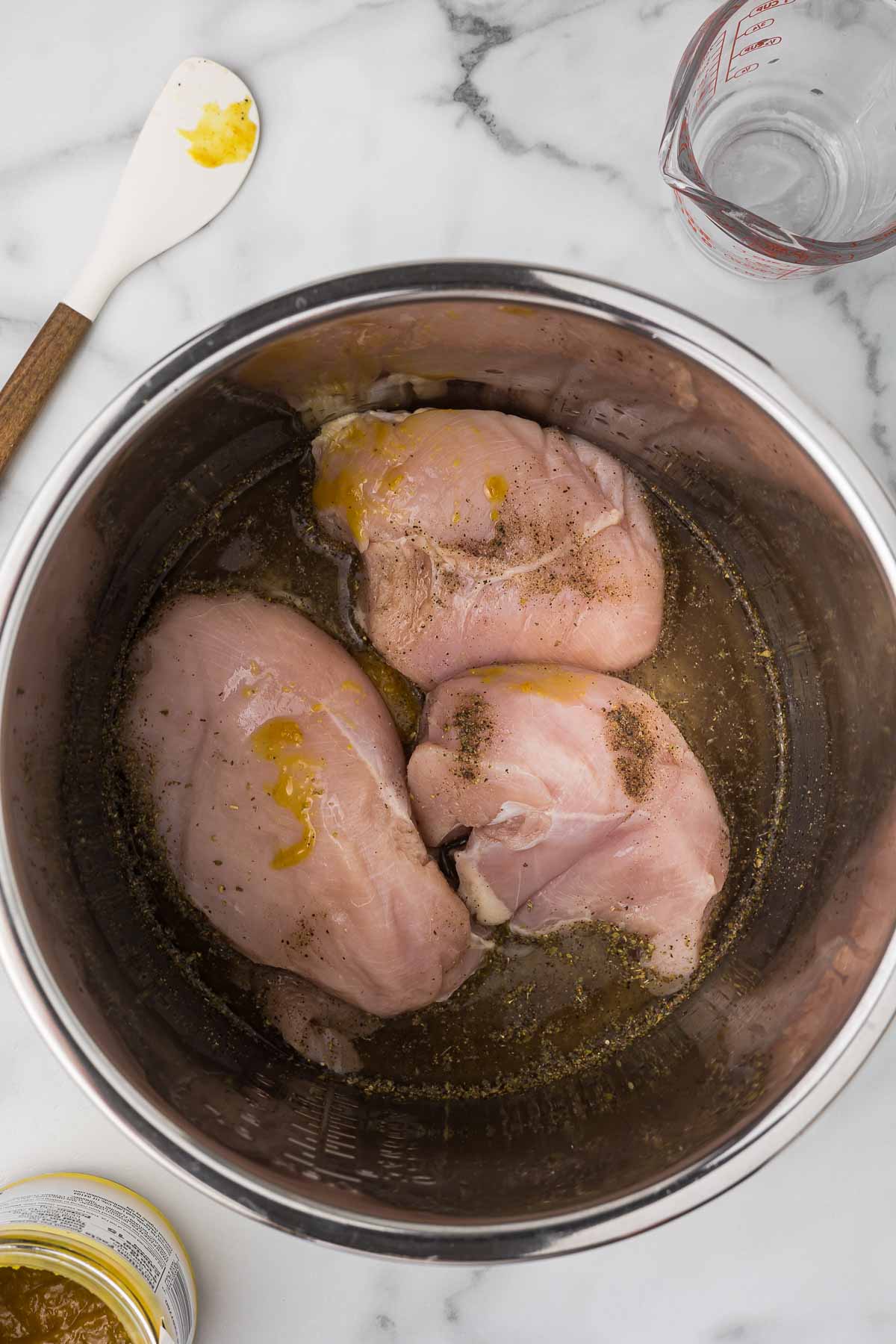 Chicken in an instant pot before cooking.