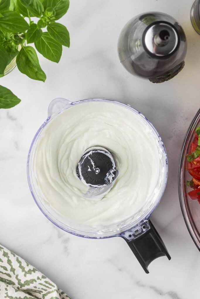 Goat cheese and heavy whipping cream in food processor