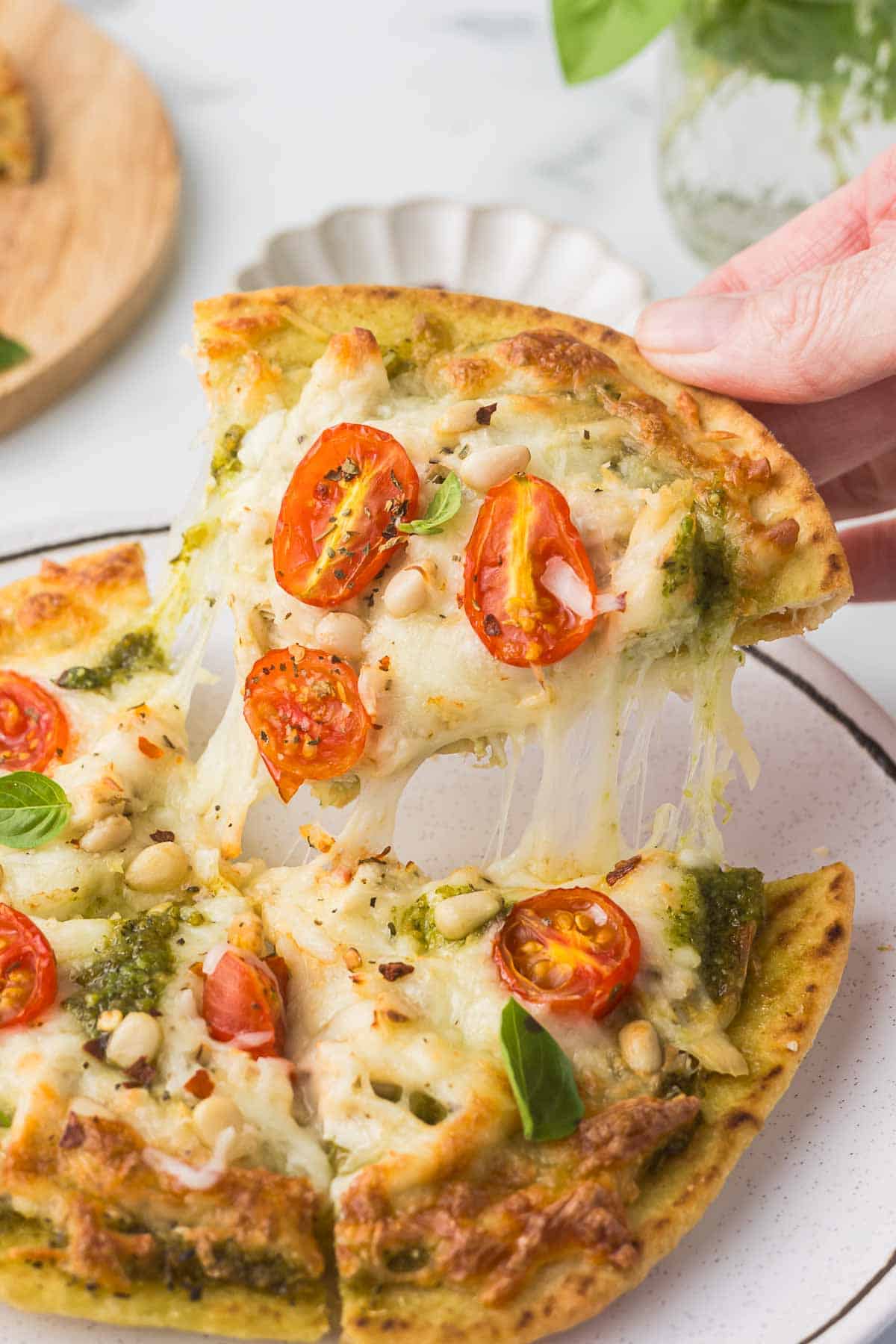 Pesto Chicken Flatbread Pizza on a plate.