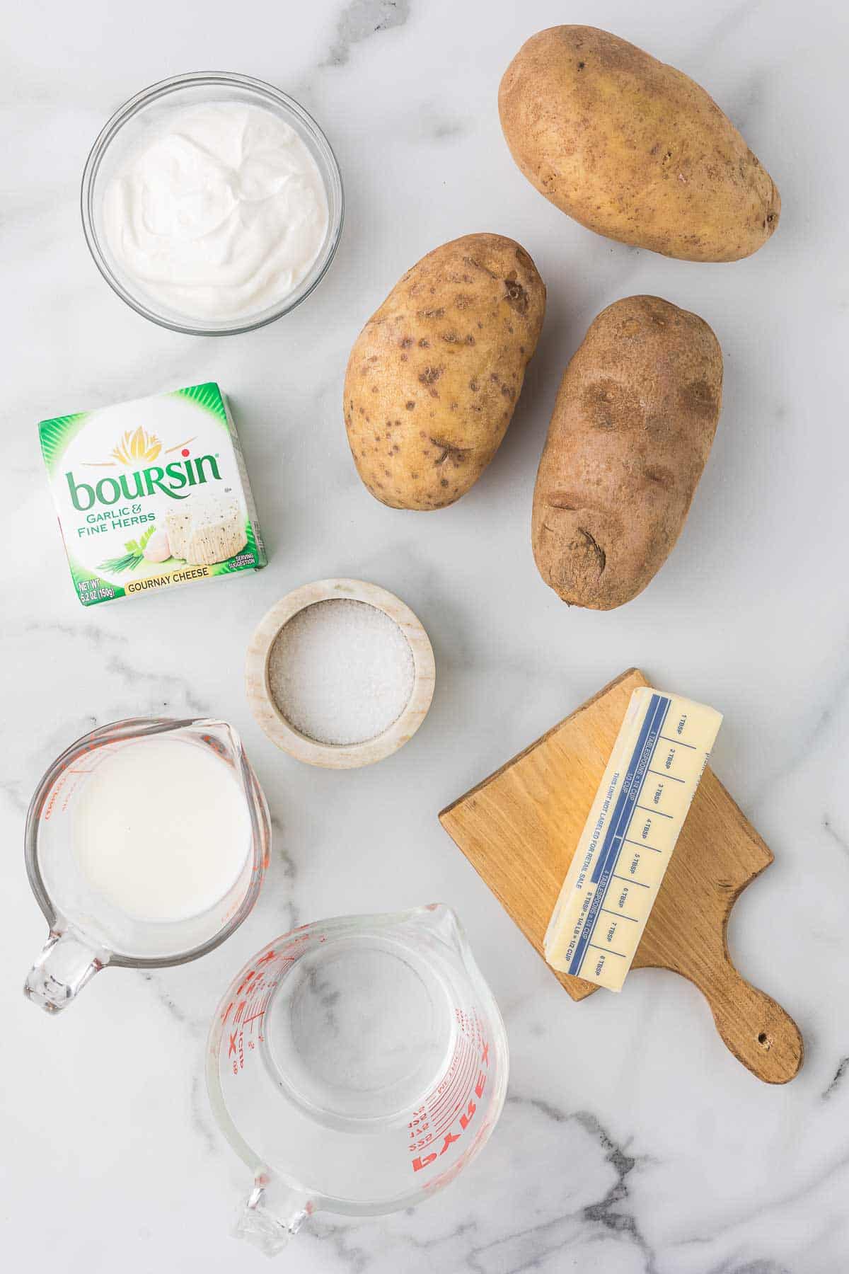 Ingredients to make mashed potatoes with boursin cheese.