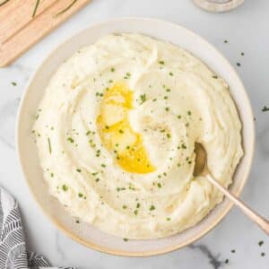 Mashed Potatoes with Boursin Cheese in a bowl with a spoon.