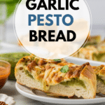 A slice of pesto garlic bread on a white plate, topped with melted cheese and basil leaves. Other slices are in the background, next to a jar of pesto and a small bowl of sauce. Text overlay reads "Garlic Pesto Bread.