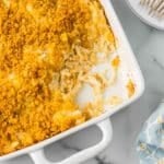 Hashbrown Casserole in a white casserole dish.
