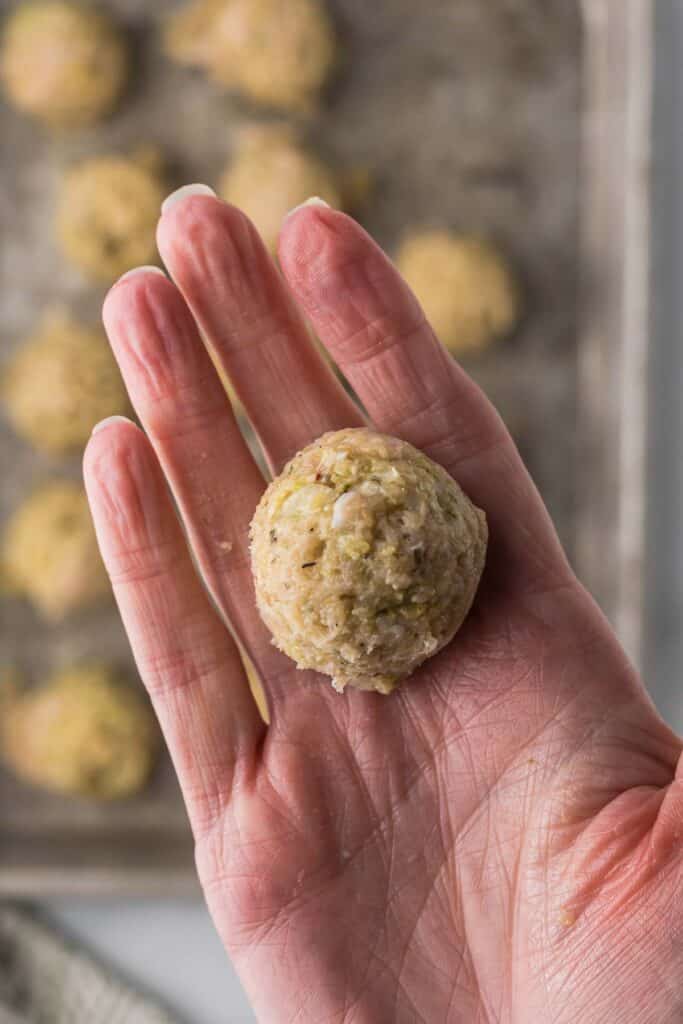 One meatball in my hand to show the size of the meatballs.