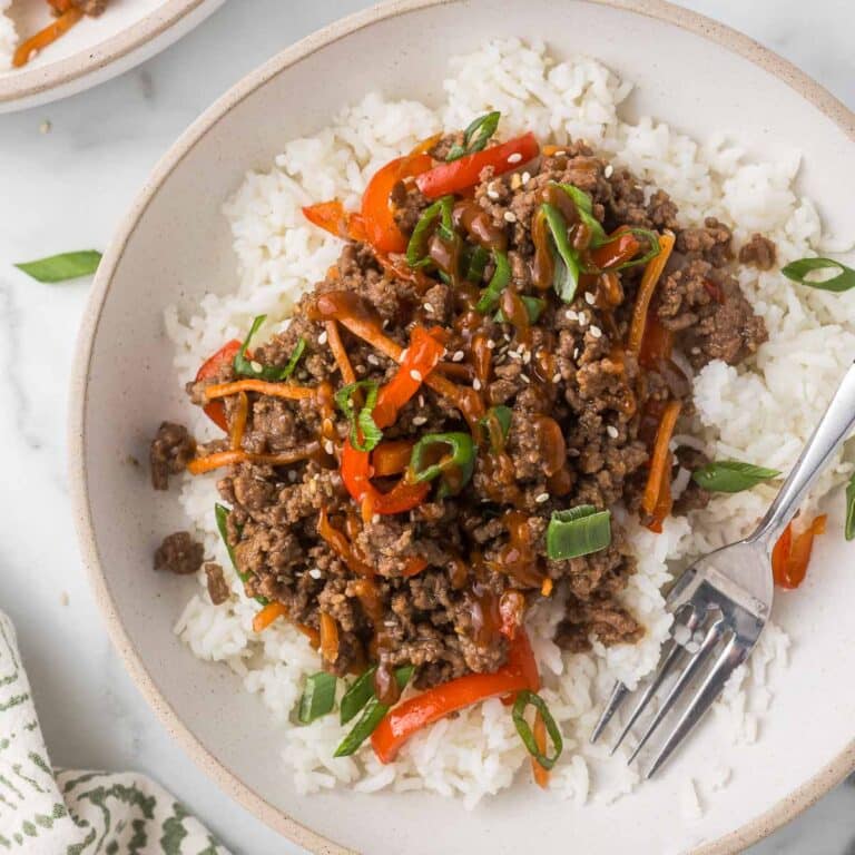 Ground Beef Teriyaki over rice with green onions and sesame seeds.