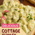 Close-up of a serving of creamy cottage cheese egg salad on a slice of bread, garnished with fresh herbs. Text overlay reads 'Delicious Cottage Cheese Egg Salad' and 'cookingupmemories.com'.