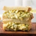 Cottage Cheese Egg Salad sandwich on a cutting board.