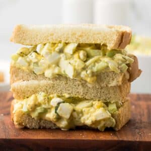 Cottage Cheese Egg Salad sandwich on a cutting board.