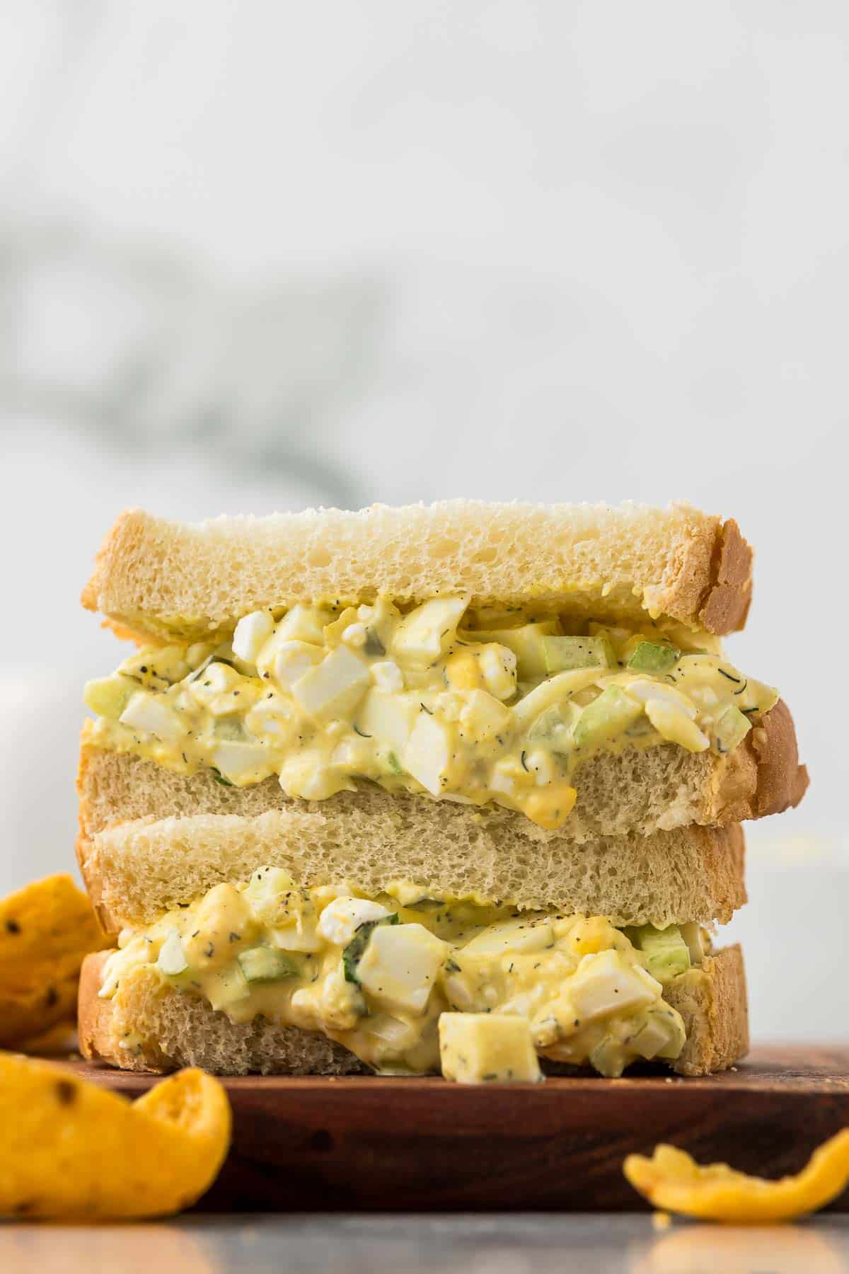 An egg salad sandwich that has cottage cheese included for additional protein.