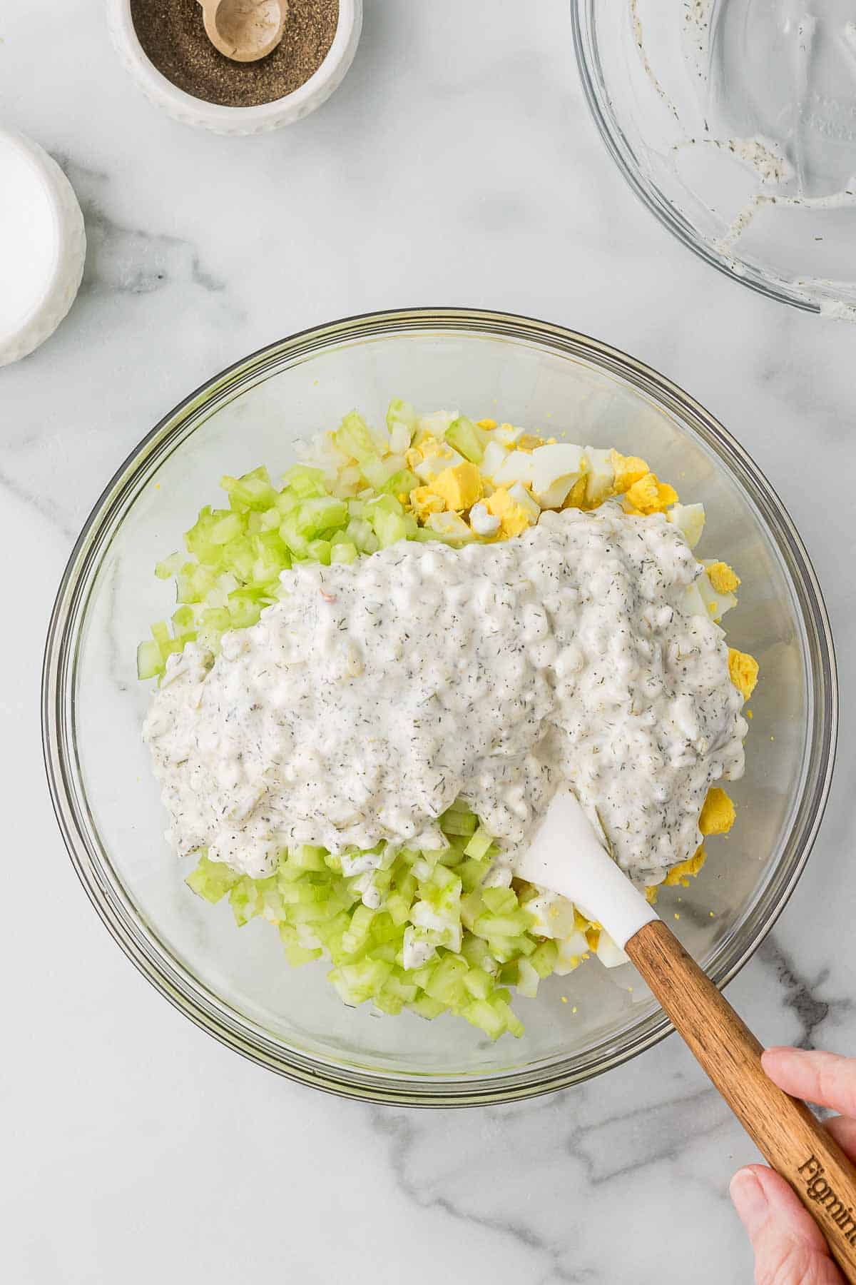 The dressing added to celery, onion and egg to make egg salad.