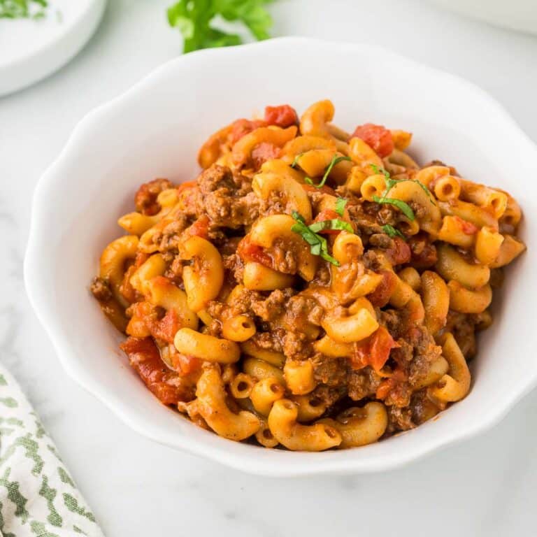 Traditional goulash in a white bowl.