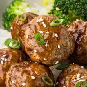 Turkey teriyaki meatballs with green onions and sesame seeds.