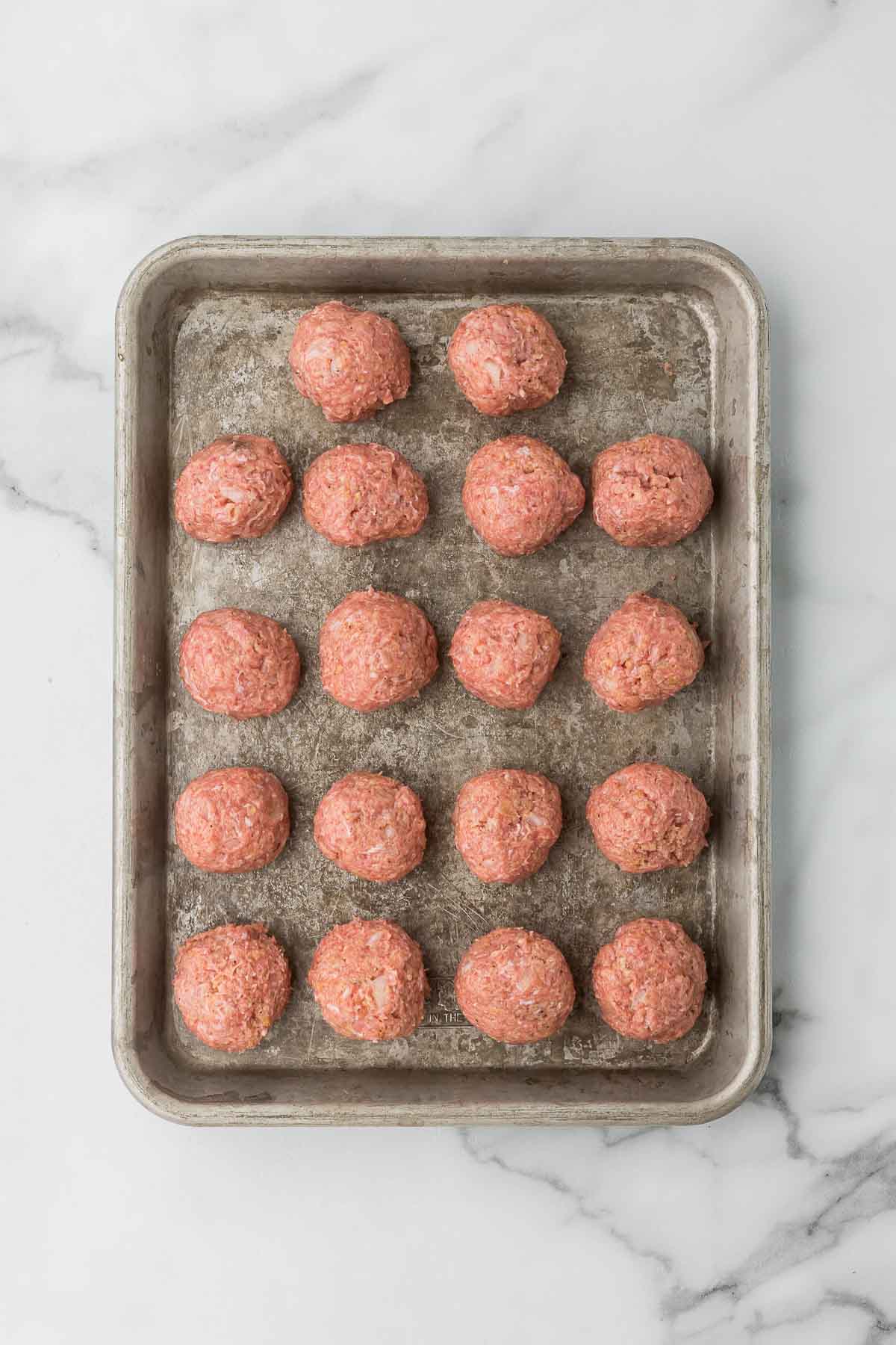 Raw meatballs before baking.