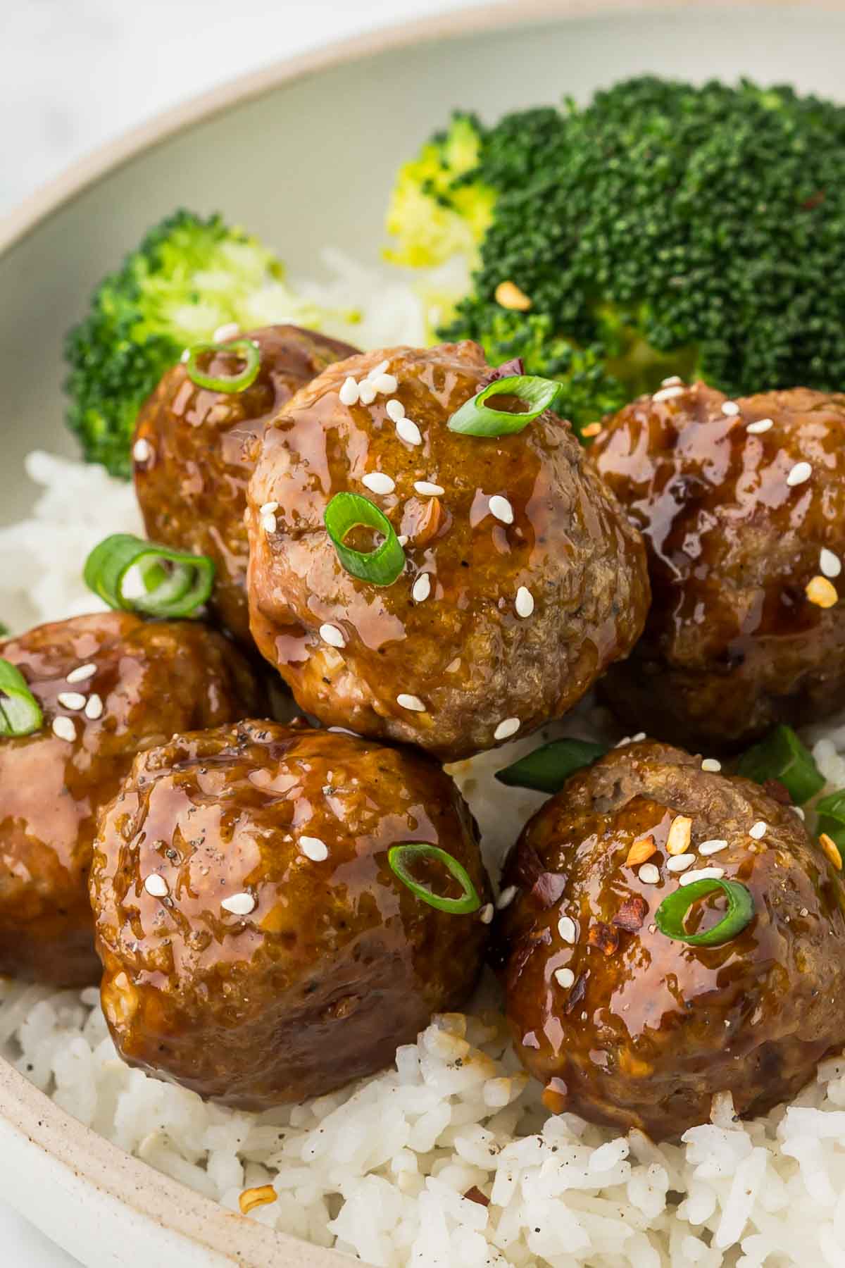 Turkey Teriyaki Meatballs in a serving dish with rice.