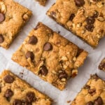 Chocolate Chip Blondies made with brown butter cut into squares on parchment paper.