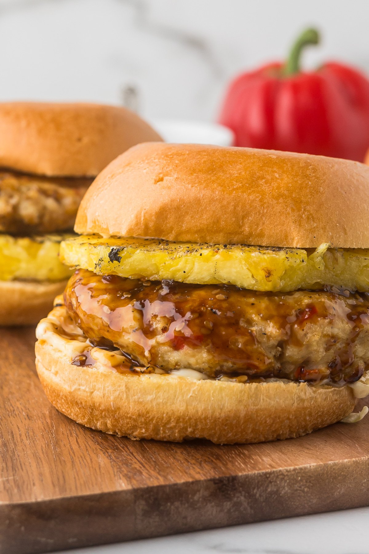 Chicken burgers with mayo and grilled pineapple