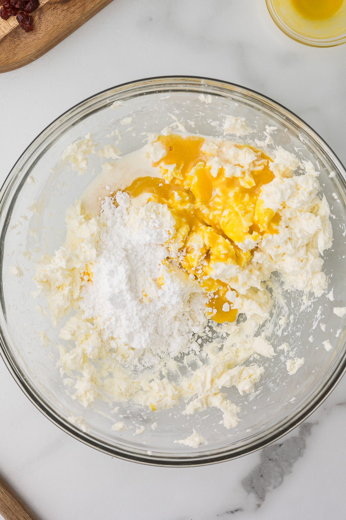 Orange concentrate, vanilla, and powdered sugar mixed with cream cheese.