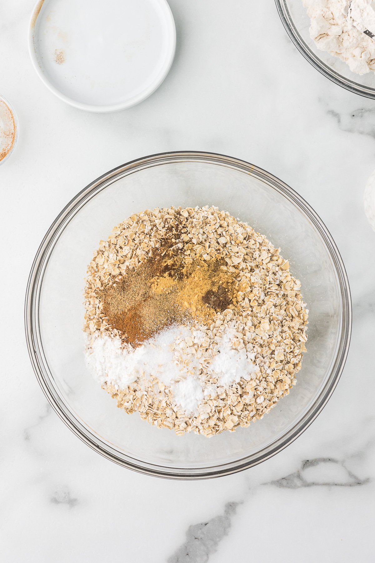 Flour, rolled oats, baking soda, baking powder, salt, and chai spices whisked together.