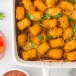 Tater Tot Casserole with Taco Flavors in a white baking dish.