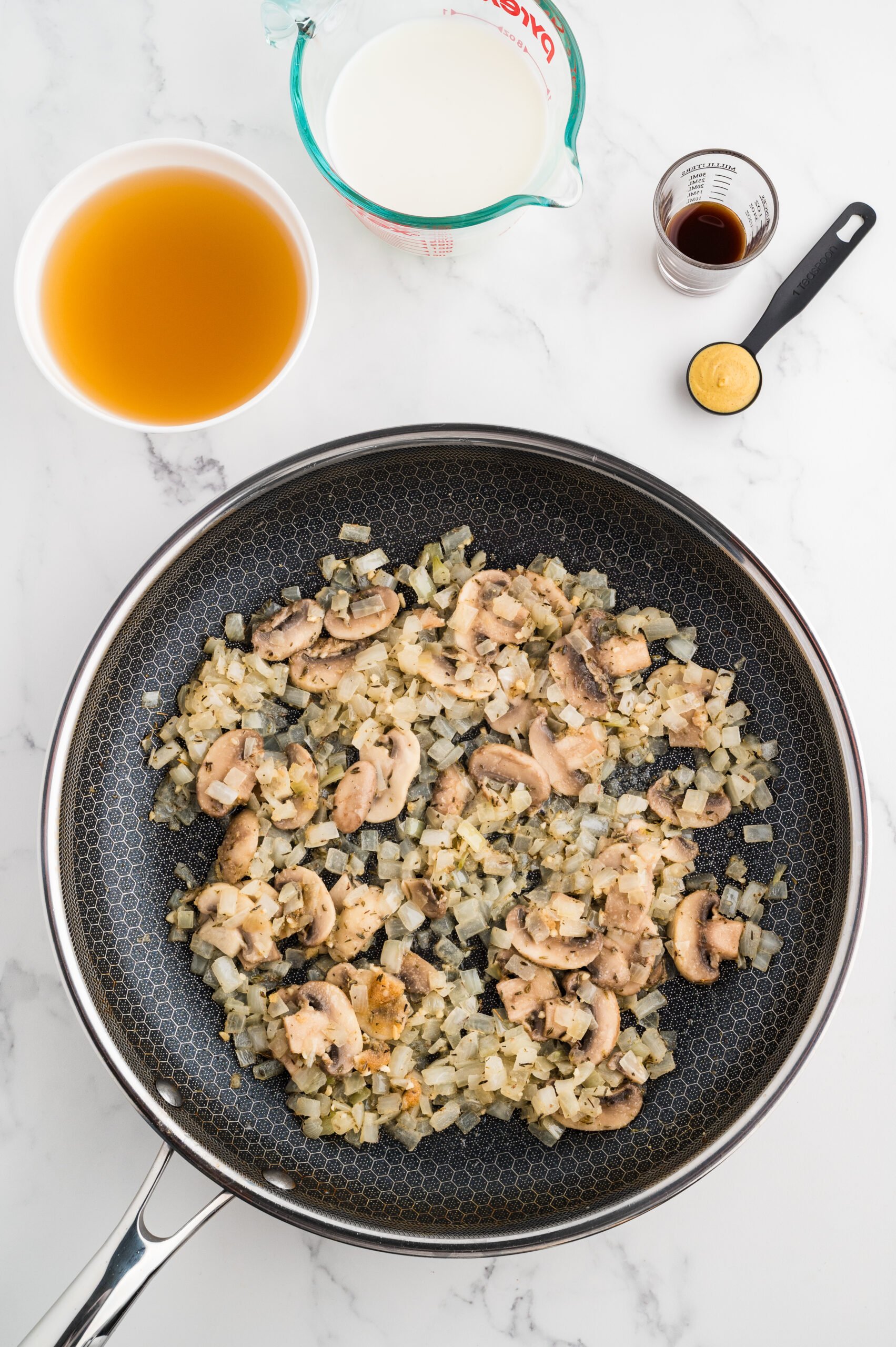 Vegetables with white wine added to deglaze the pan.
