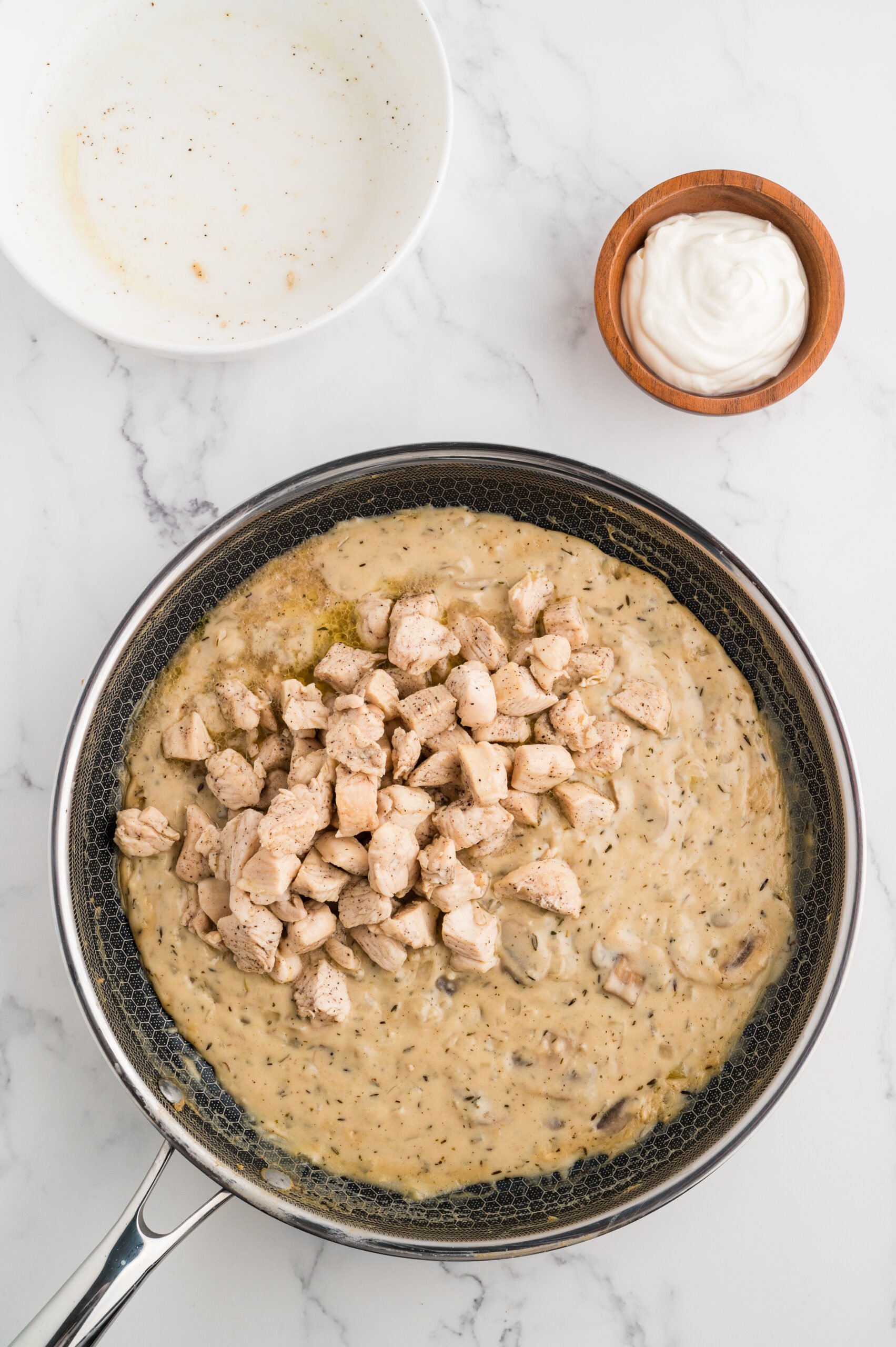 Chicken added back to the sauce for cream chicken stroganoff recipe.