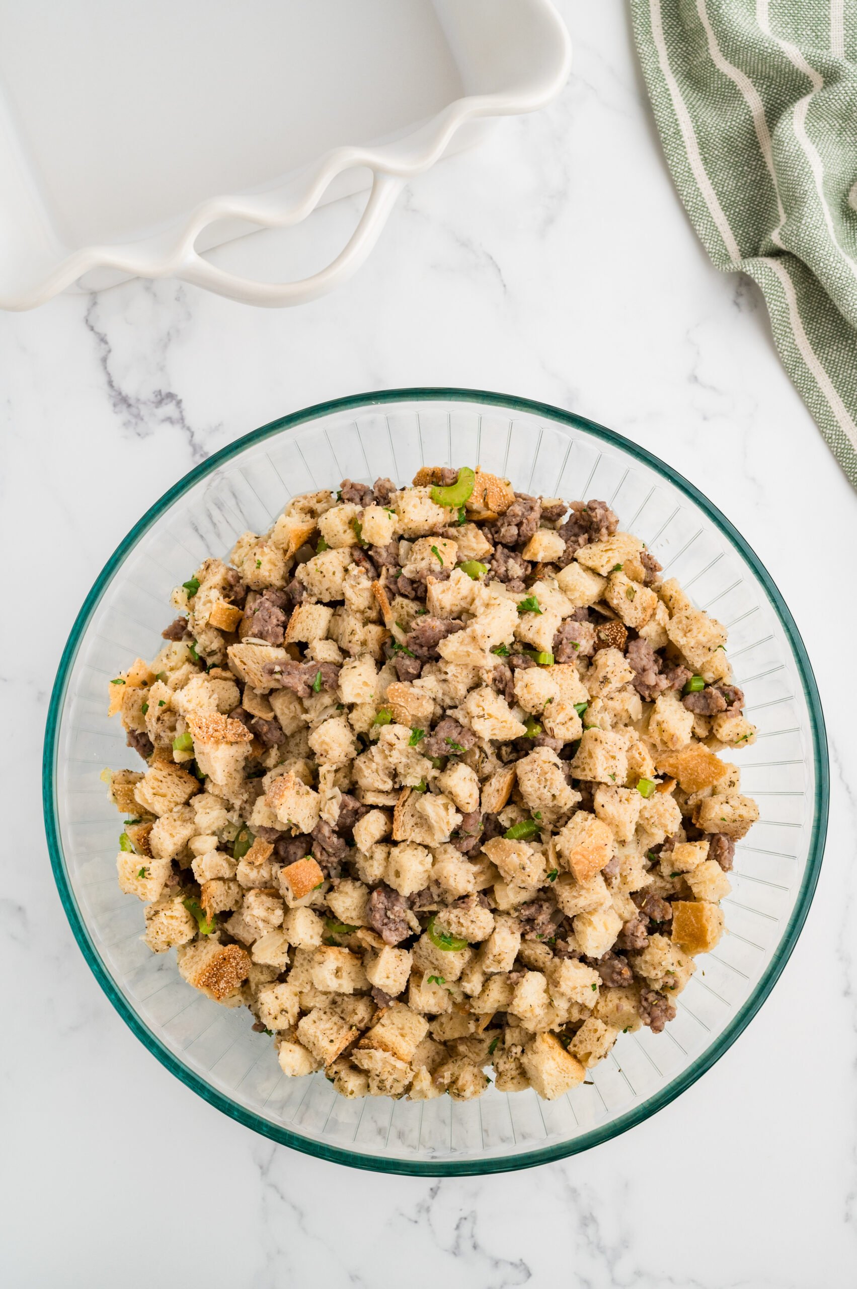 Sourdough sausage stuffing mixture tossed with herb broth until all bread cubes are moistened.
