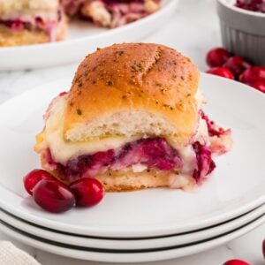 Cranberry Turkey Sliders made with Hawaiian rolls, cranberry sauce, turkey and cheese.