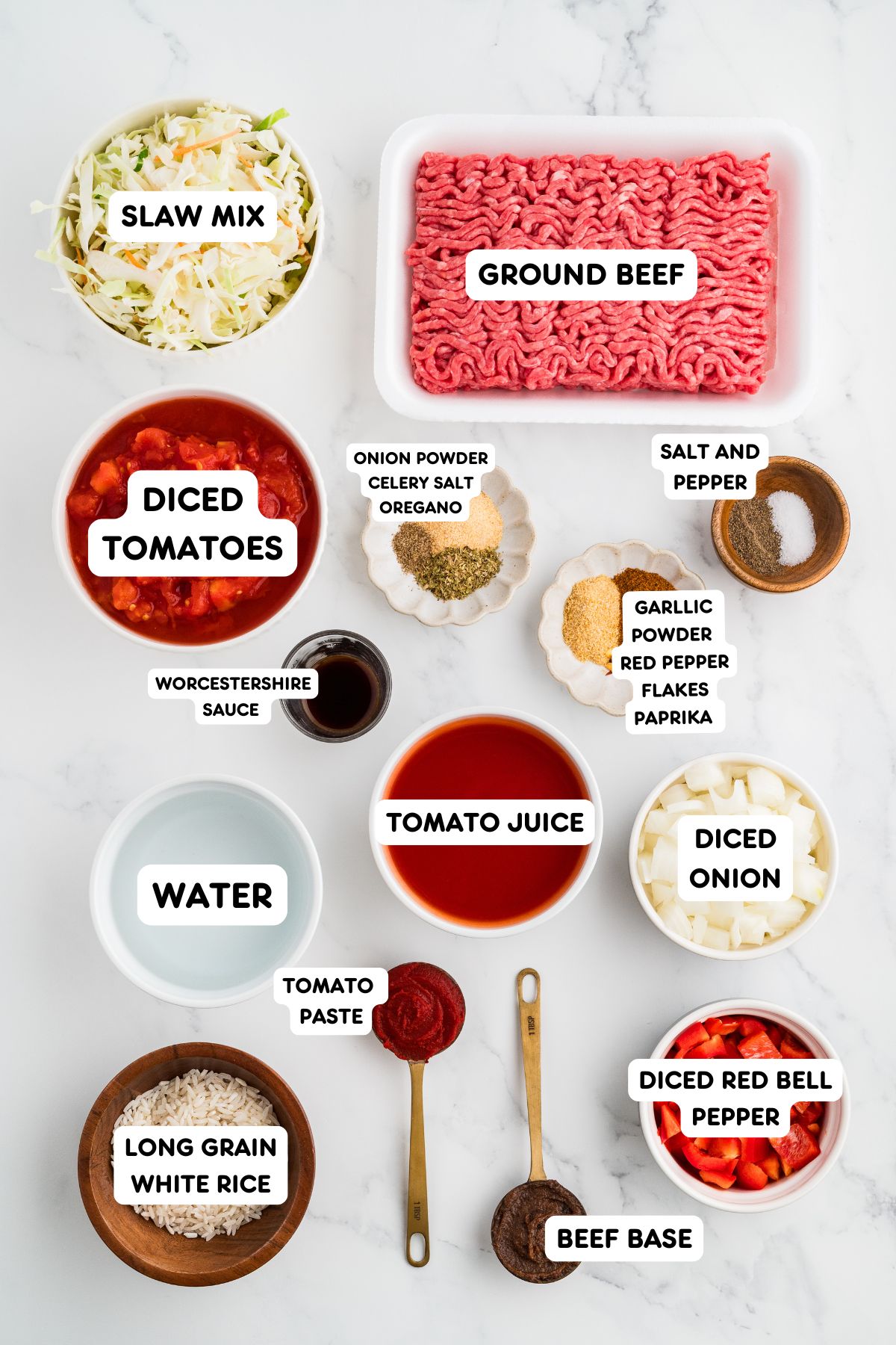 Ingredients to make cabbage roll soup in small bowls on a countertop.
