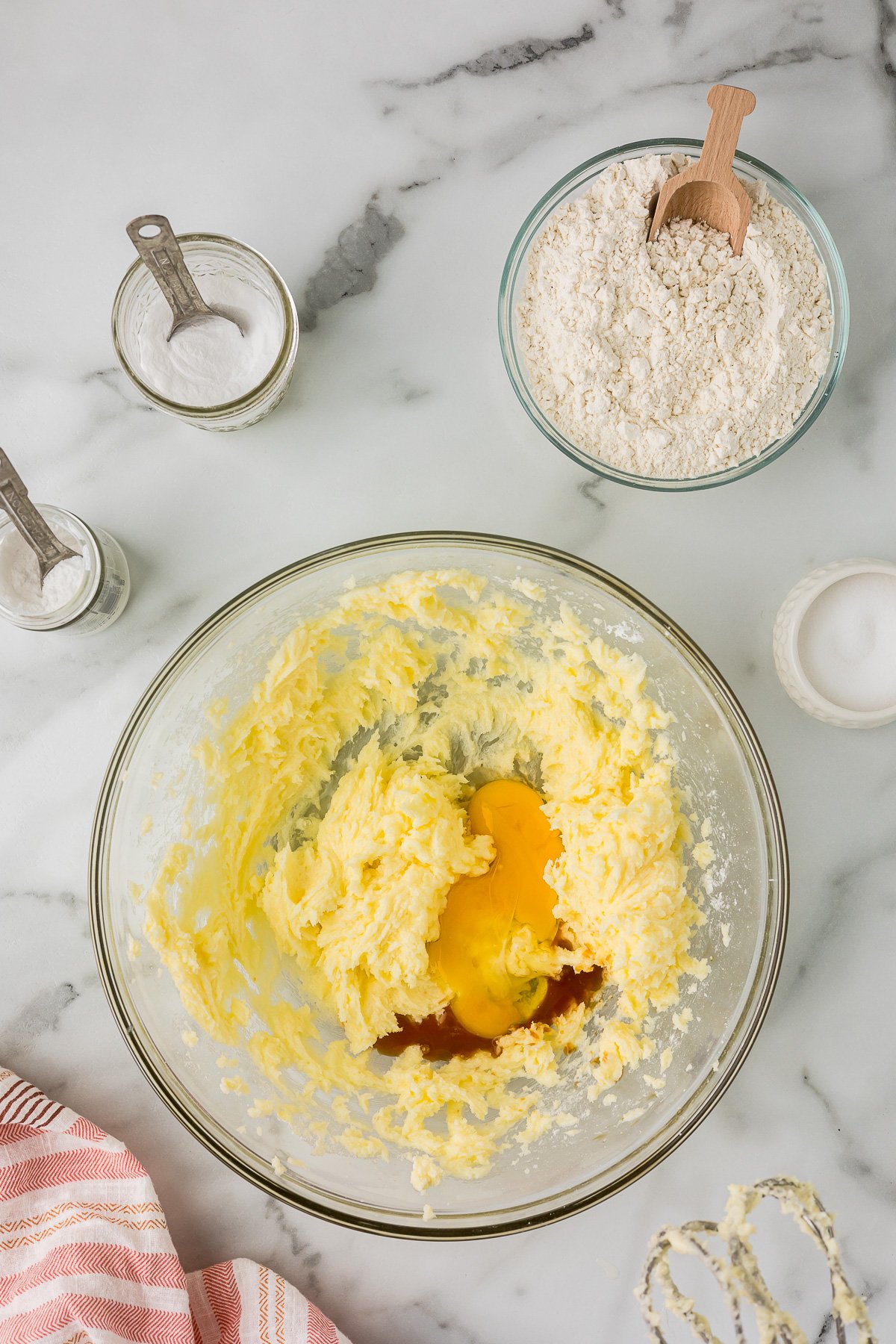 Egg and vanilla added to creamed butter and sugar while making cut out sugar cookie dough.