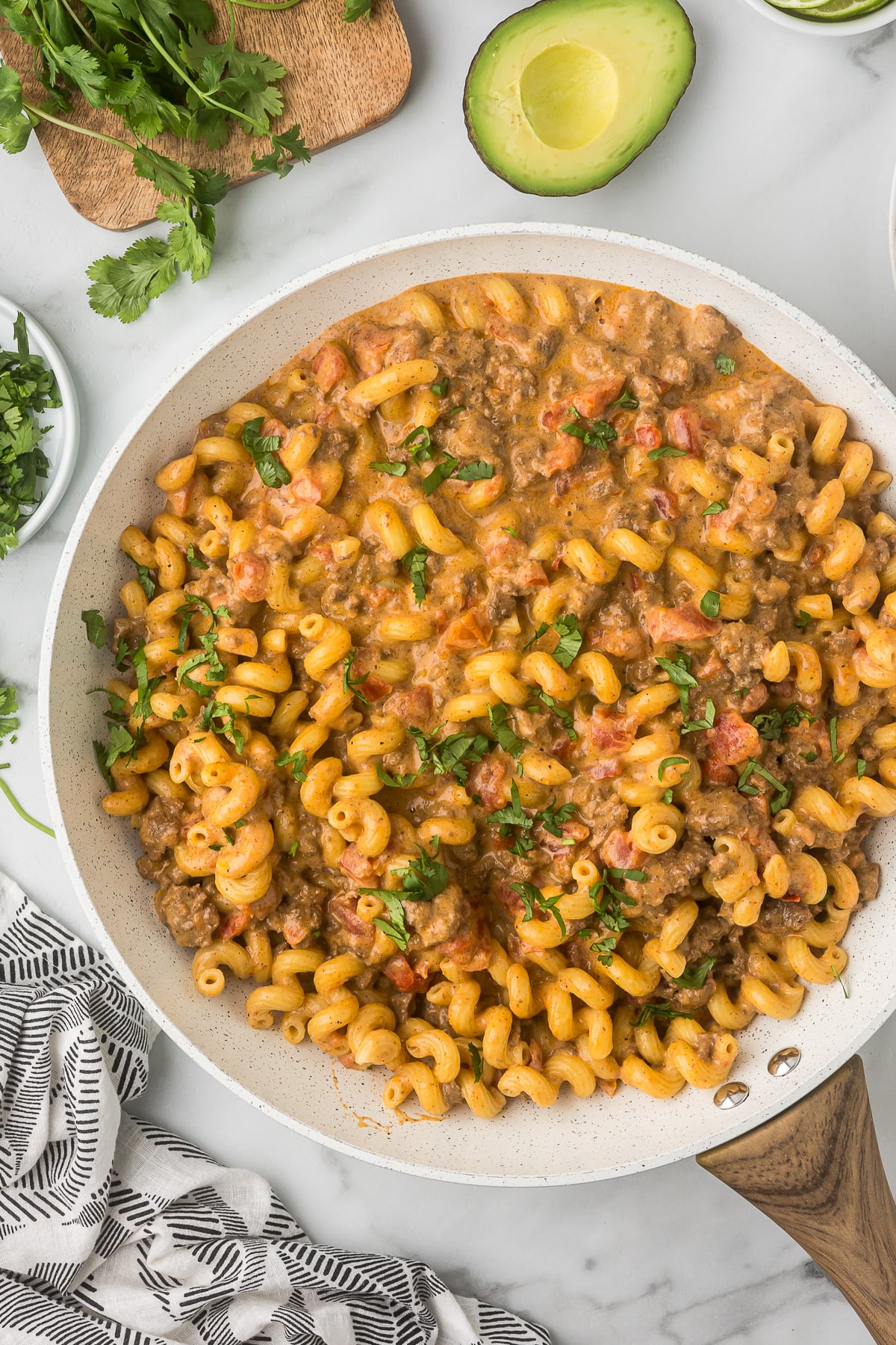 Creamy Mexican mac and cheese with ground beef in a skillet.