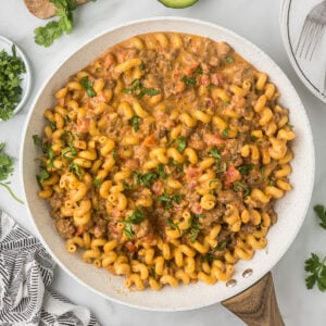 Mexican Mac and Cheese in a skillet with cilantro sprinkled on the top.