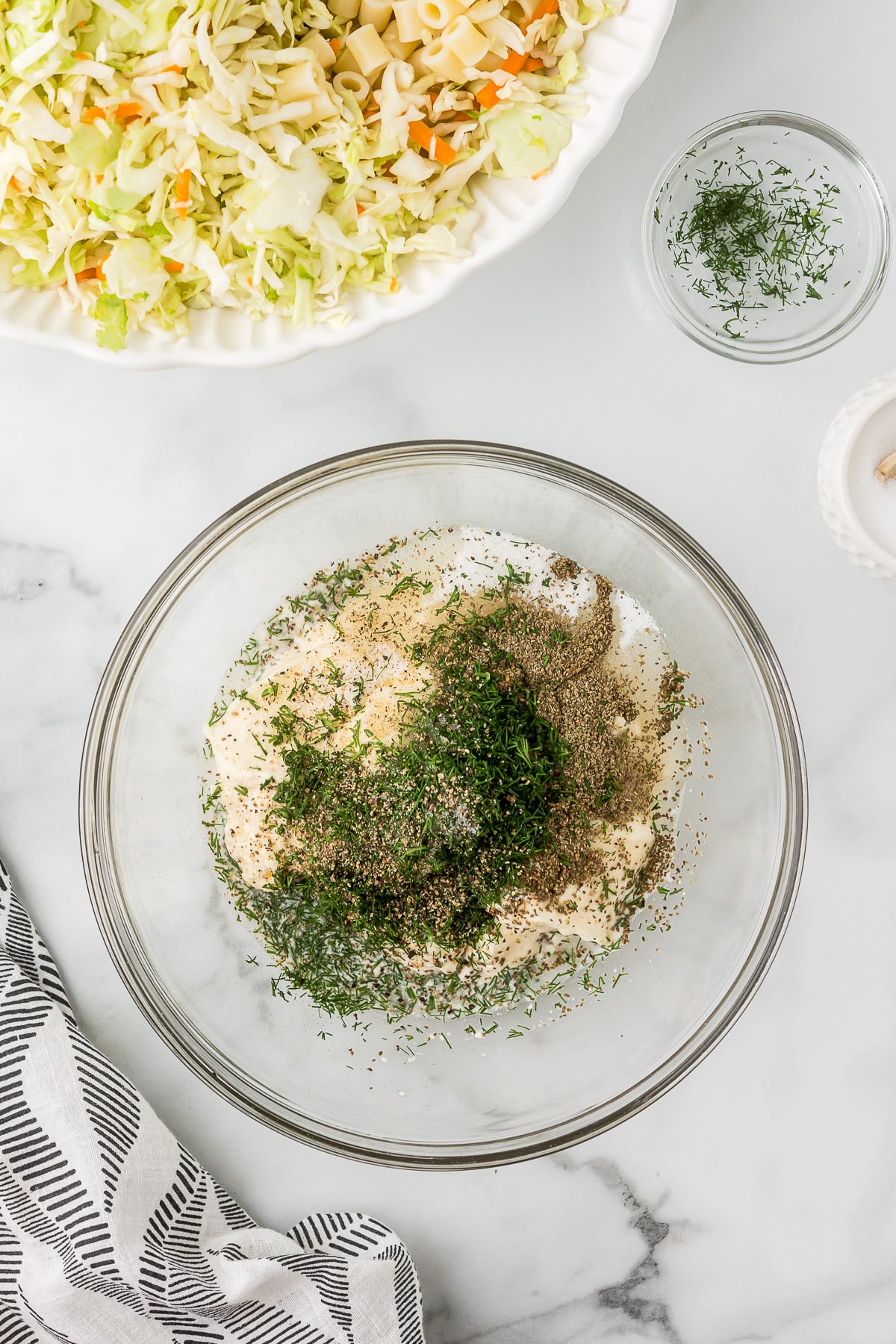 Coleslaw dressing ingredients in a mixing bowl.