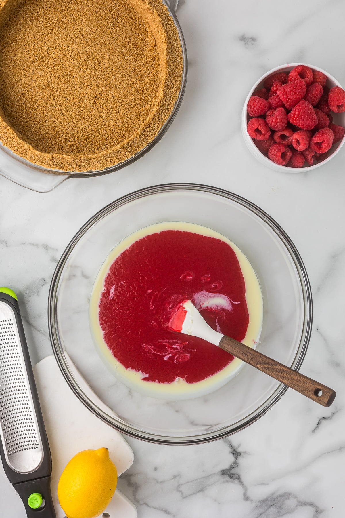 Strained raspberry puree added to sweetened condensed milk for the filling of No-Bake Raspberry Lemonade Pie.